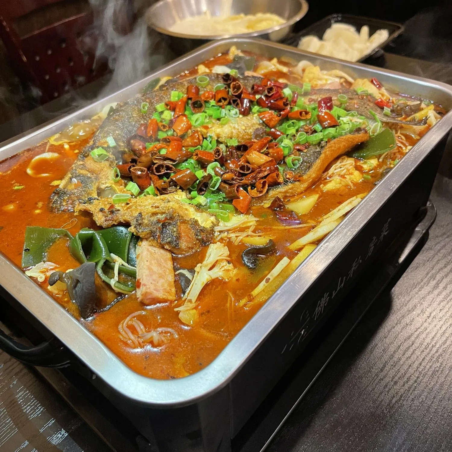 Hot pot-style grilled fish with vegetables in spicy broth at Spicy Chinese Kitchen, a Chinese Restaurant in Torrance.