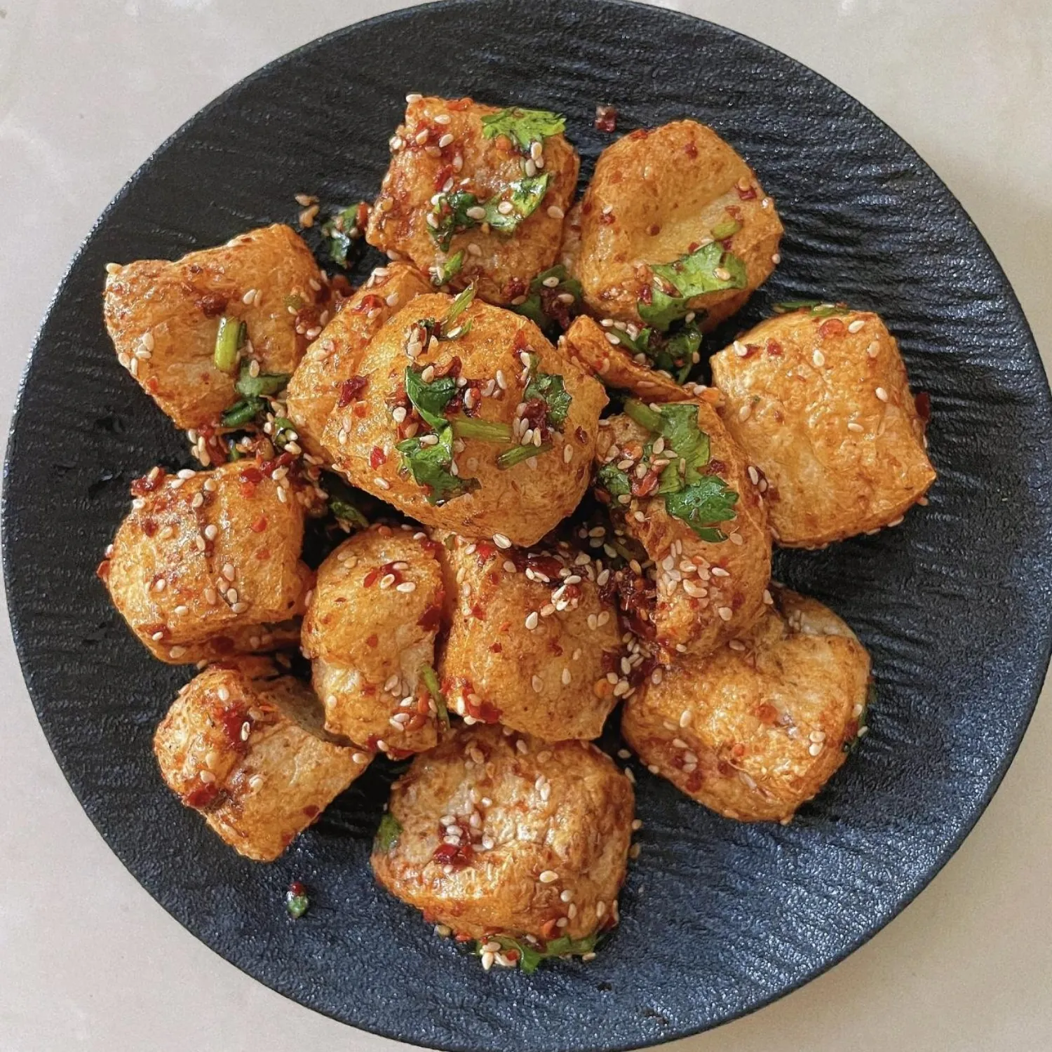 Crispy fried tofu tossed in spicy chili sauce and sesame at Spicy Chinese Kitchen, a Chinese Restaurant in Torrance.