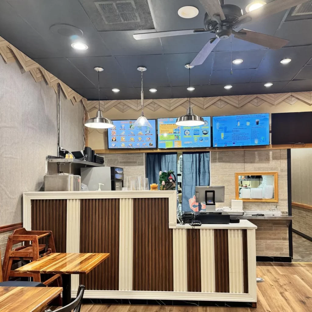 Modern front counter with digital menu screens at Spicy Chinese Kitchen, a Chinese Restaurant in Torrance.